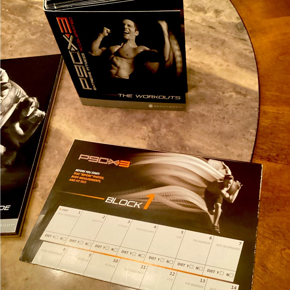 P90X Beachbody work out dvds/fitness guide, along with planner .